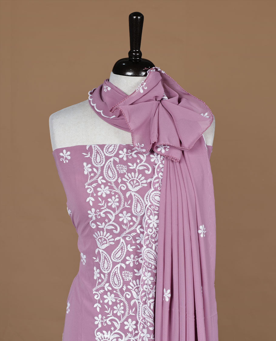 pink colour churidar material featuring white thread floral pattern on body, paired with matching bottom and dupatta.