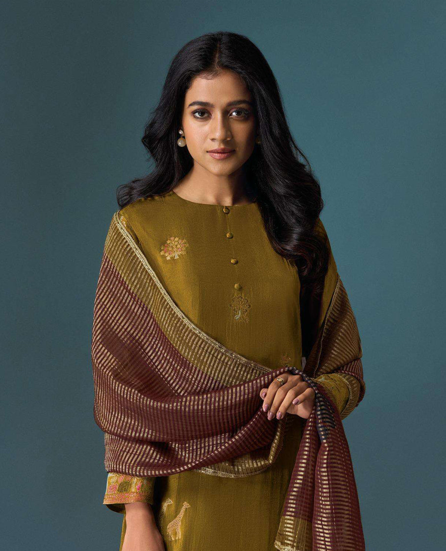 Olive colour suit material with Olivia silk jacquard top featuring elegant digital prints, paired with classic silk bottoms, and completed with a silk jari lining dupatta highlighted by digital prints