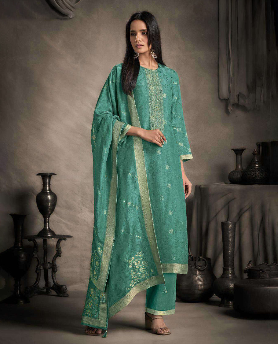 Aqua green colour suit material featuring an Akina silk jacquard top with delicate embroidery, paired with satin bottoms and completed with a matching Akina silk jacquard dupatta