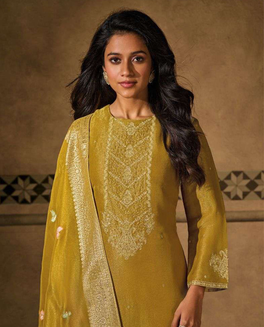 Mustard colour suit material with silk tissue embroidered top featuring elegant handwork and detailed sleeve work, paired with matching satin bottom and a contrast colour lightweight printed dupatta
