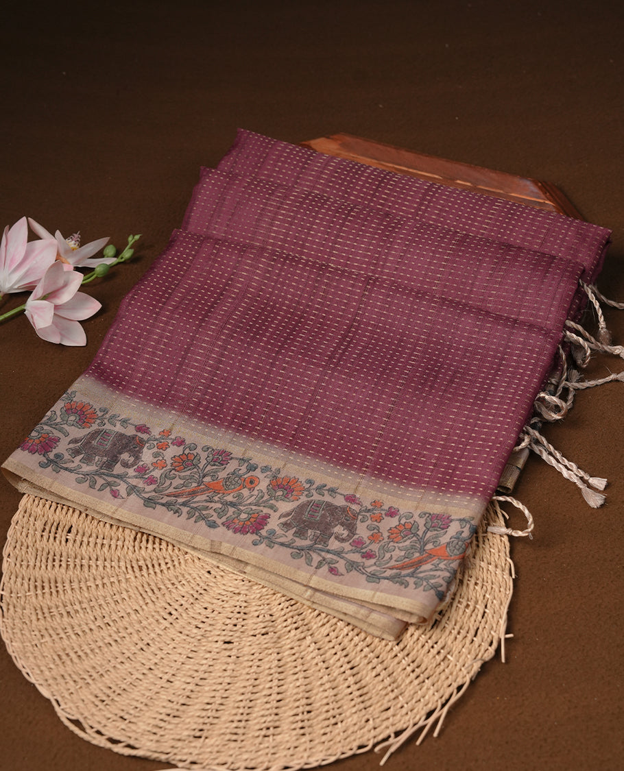 Chocolate brown colour tussar saree featuring golden zari dot stripped pattern on the body, complemented by a contrast cream colour mutlicolour floral kodi & animal print on border & pallu, paired with a matching blouse.