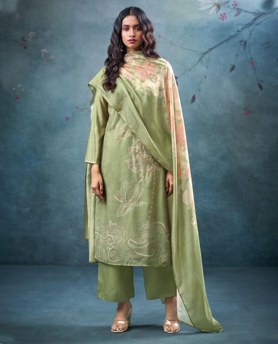 Pista Green colour suit material with pakiza silk printed top featuring subtle embroidery on the body, paired with matching bottom and lightweight printed dupatta.