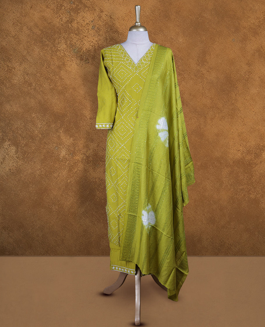 Lime green churidar set featuring V neckline, three‑fourth sleeves, and bandhani‑style dotted print on body, paired with a matching patterned dupatta.