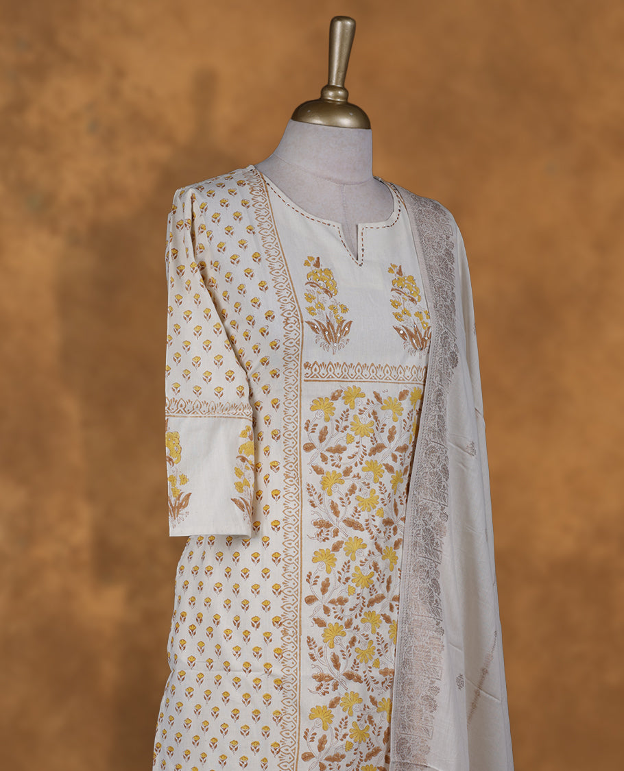 Ivory colour churidar set featuring thread embroidered on neckline, sleeves, and Yellow colour floral printed pattern on body , Paired with a matching dupatta