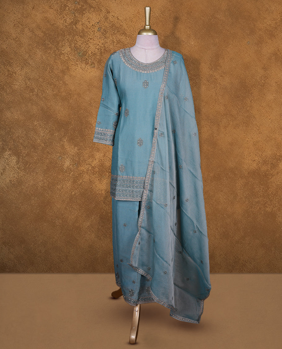 Dusty blue colour sharara set featuring gold colour stone worked on neckline, sleeves, and stone scattered pattern on body , Paired with a matching dupatta