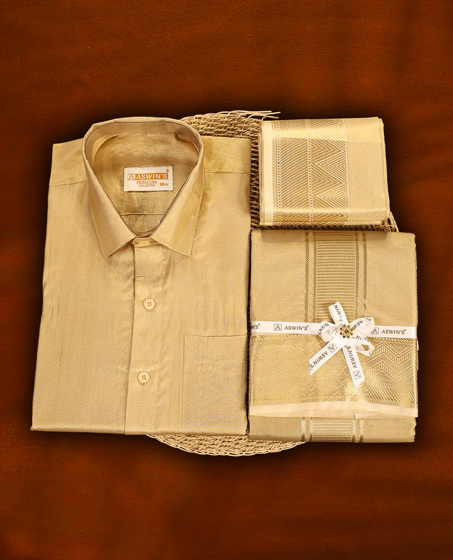 Biscuit colour Aswin’s wedding set featuring a rich silk shirt, matching dhoti, and angavastram adorned with elegant golden zari weave, complemented by a towel and fragrance, perfect for grand festive occasions.