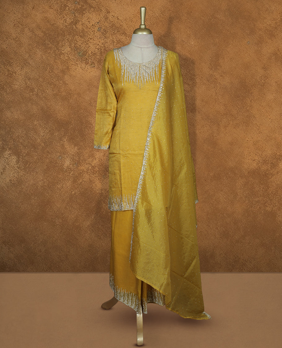 Yellow colour sharara set featuring gold colour stone worked on neckline, sleeves, and Stone scattered on body , Paired with a matching dupatta