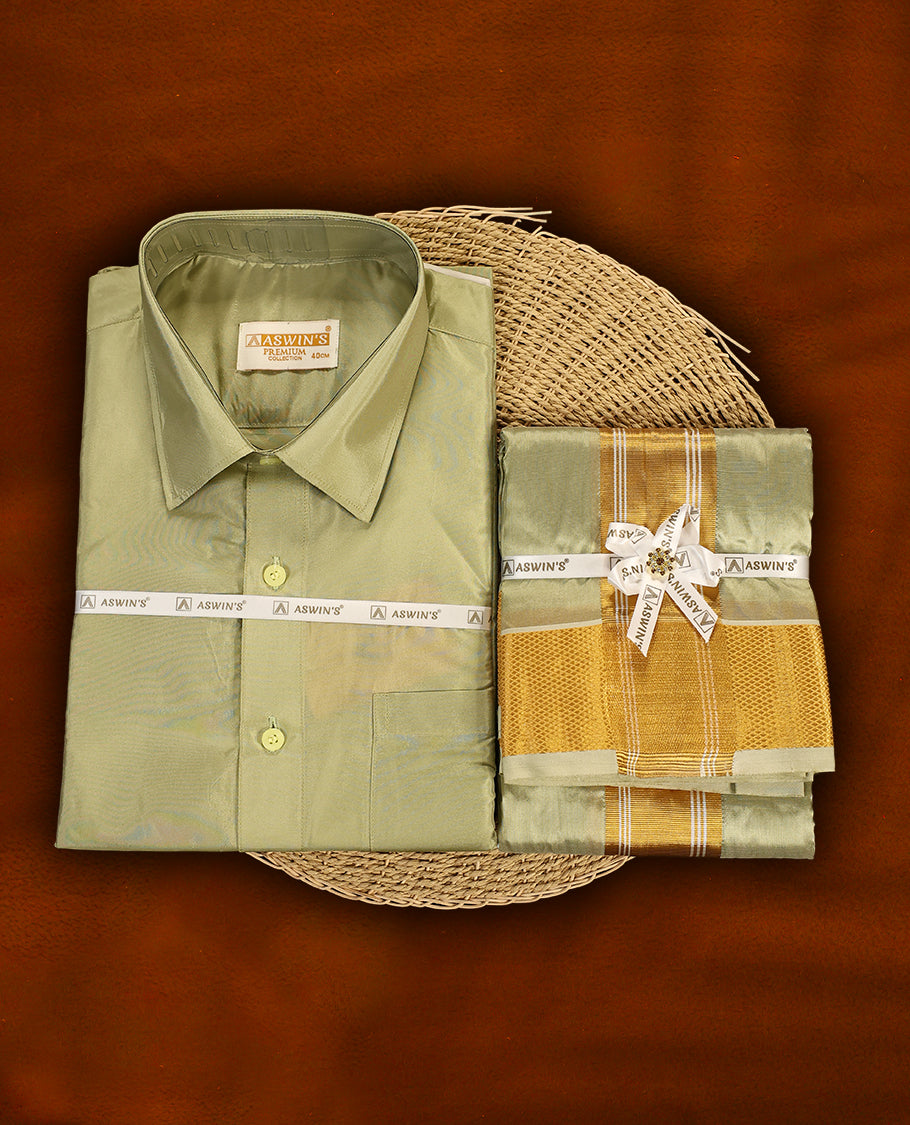 Fir green colour Aswin’s wedding set featuring a premium silk shirt, matching dhoti with rich golden zari border, complemented by a towel and fragrance, crafted for graceful festive celebrations.