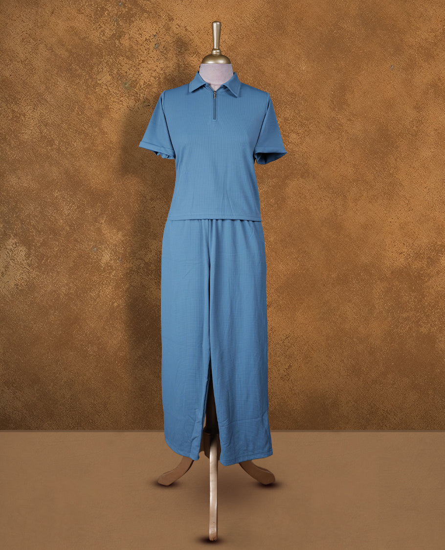 Teal colour coord set styled with a T shirt design with zip detailed & collar , short sleeve, pair a matching bottom pant .