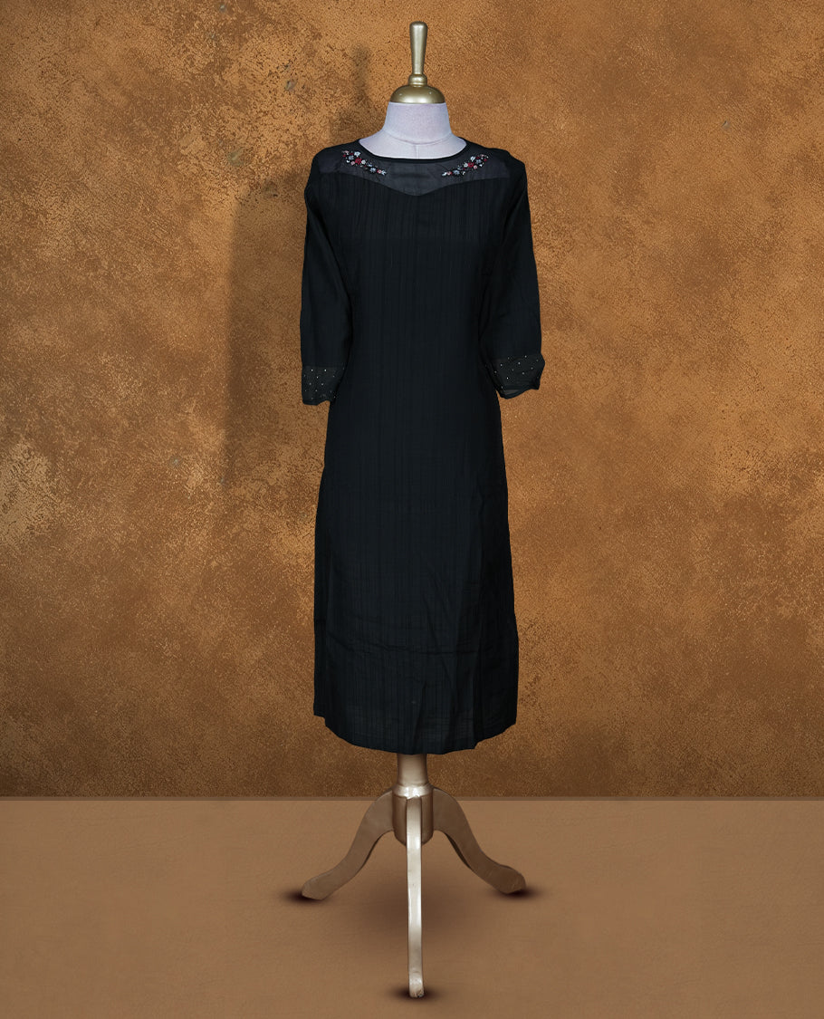 Black colour kurti featuring thread embroidery on neckline and sleeve, knee length design.
