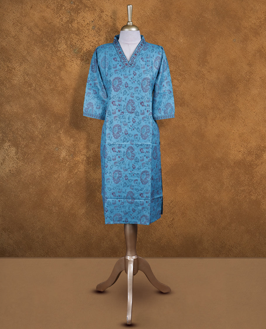 Blue colour kurti with styled with a thread pattern around neckline, print on body knee length design, and a sleeve .