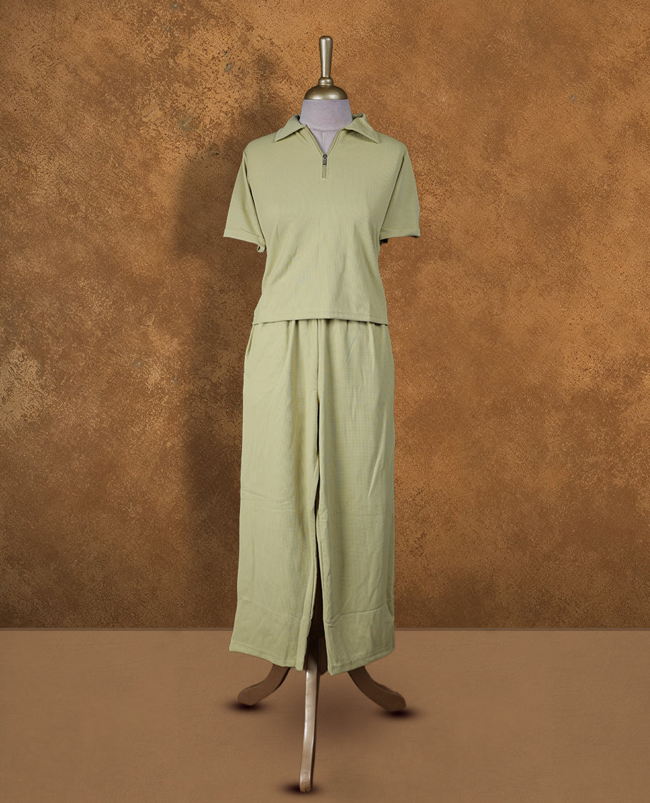Pale yellow colour coord set styled with a T shirt design with zip detailed & collar , short sleeve, pair a matching bottom pant .