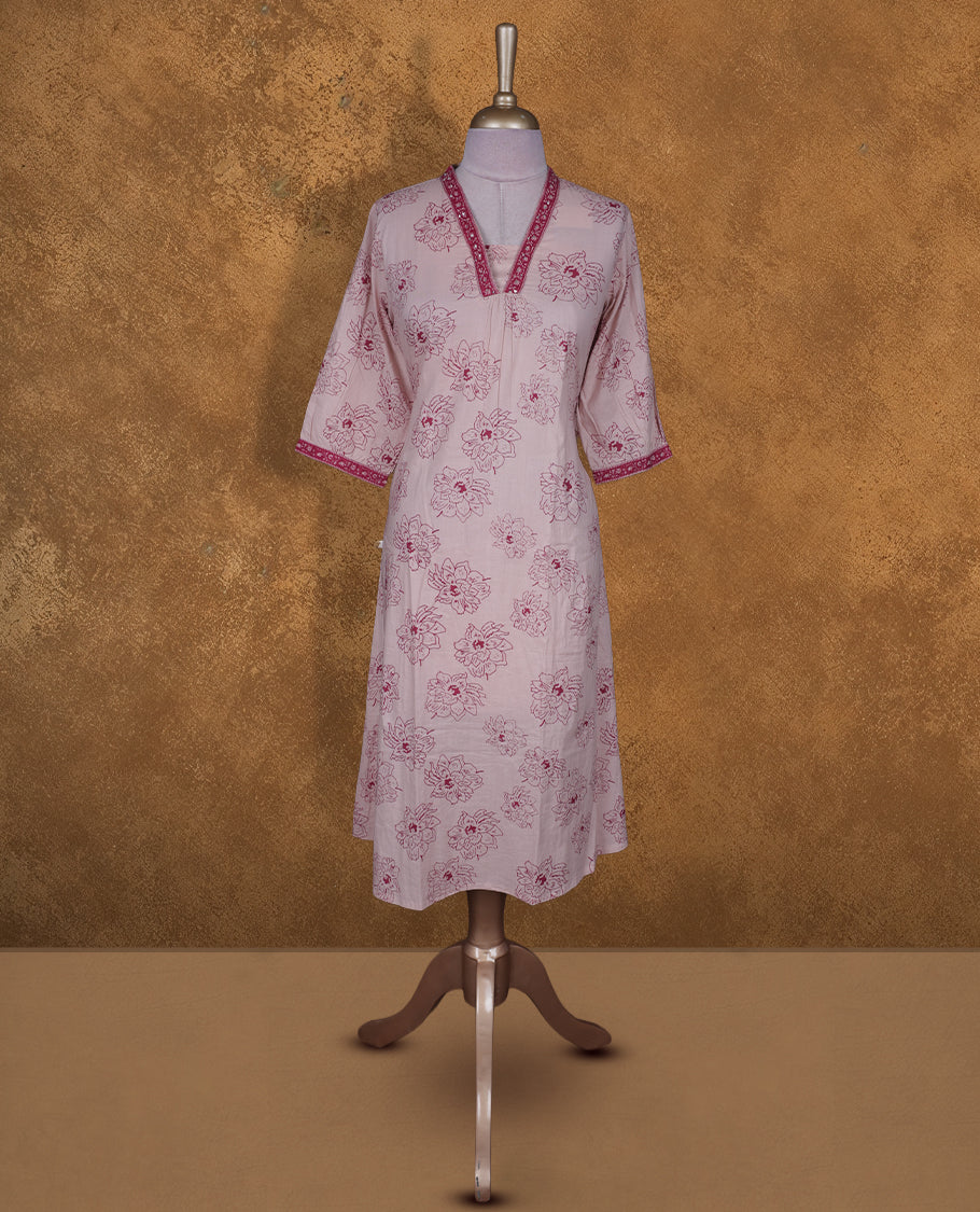 Baby pink colour kurti By Vismay styled with a thread pattern around neckline, print pattern across body knee length design, and a sleeve .