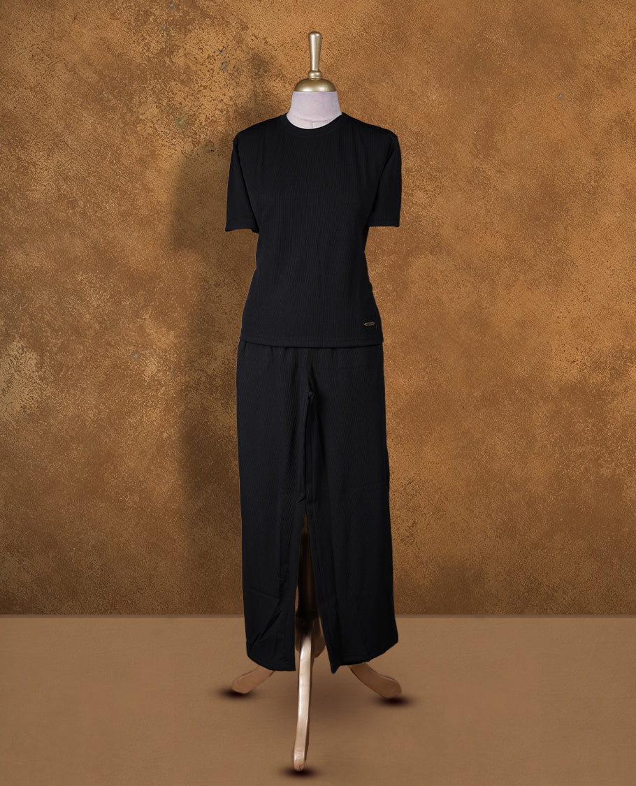 Black colour coord set styled with a T shirt design with short sleeve, pair a matching bottom pant .