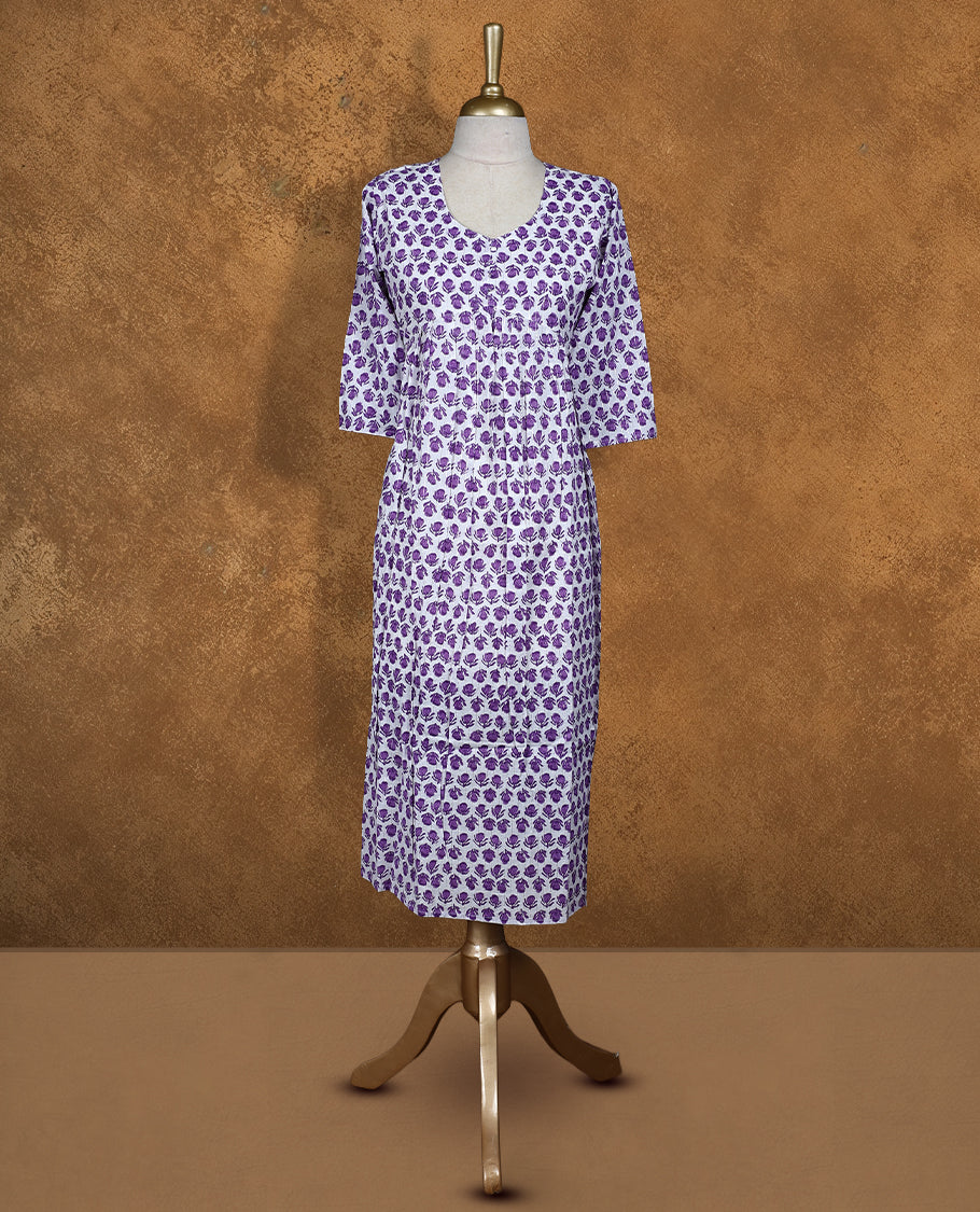 White colour Kurti featuring Purple floral print pattern across, round neckline with botton detail, and sleeves,