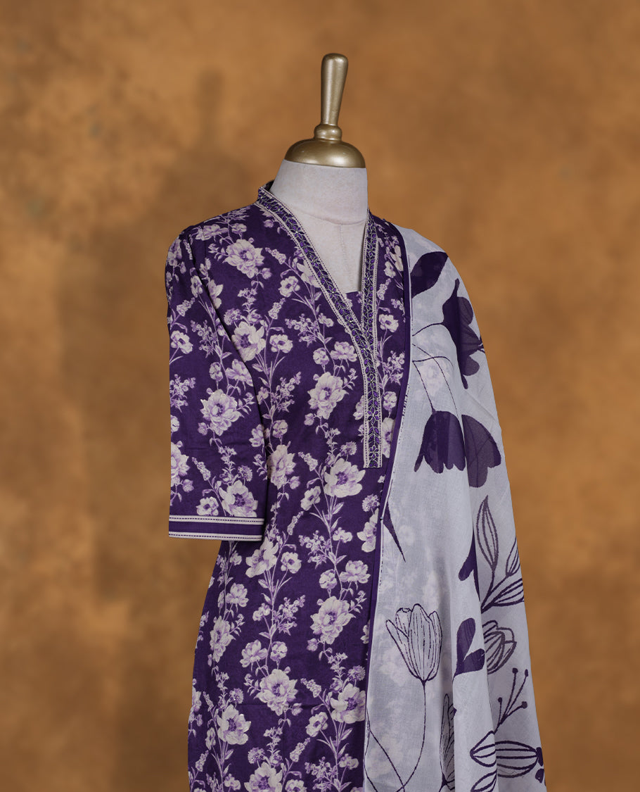 Violet colour churidar set featuring elegant white thread embroidery on the neckline, sleeves, and scattered motifs across the body, Paired with a matching embroidered dupatta