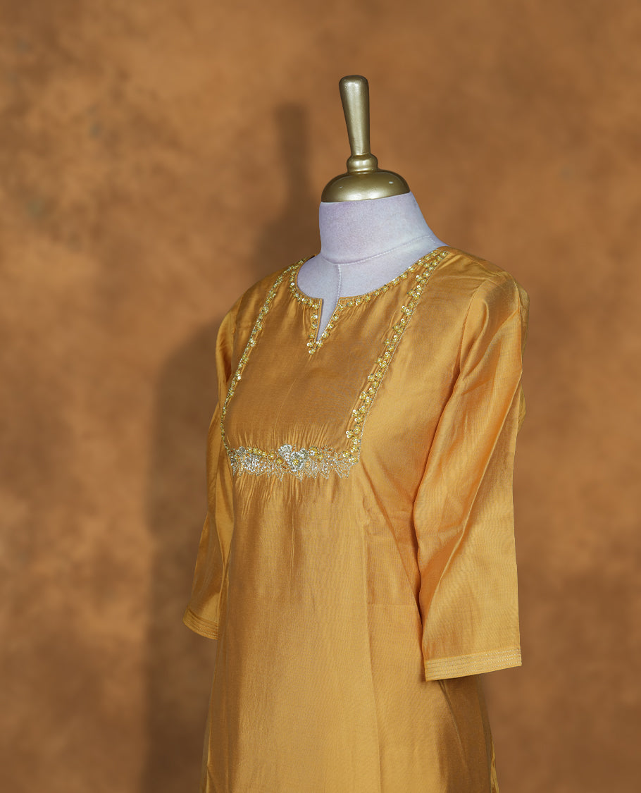 Yellow colour coord setwith styled with a thread & beats pattern around neckline & sleeve, knee length design .