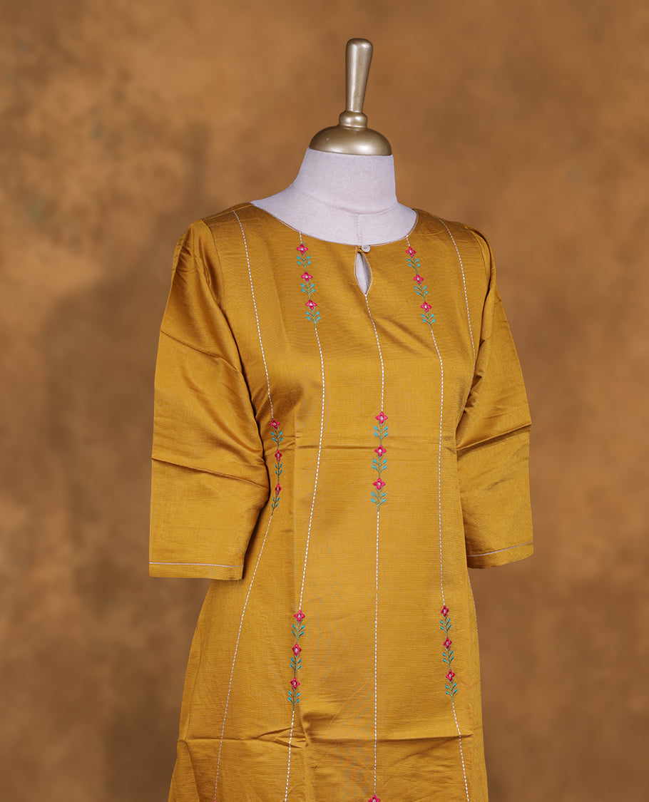 Mustard colour kurti with styled with a thread pattern around neckline & across body, knee length design, and a sleeve .