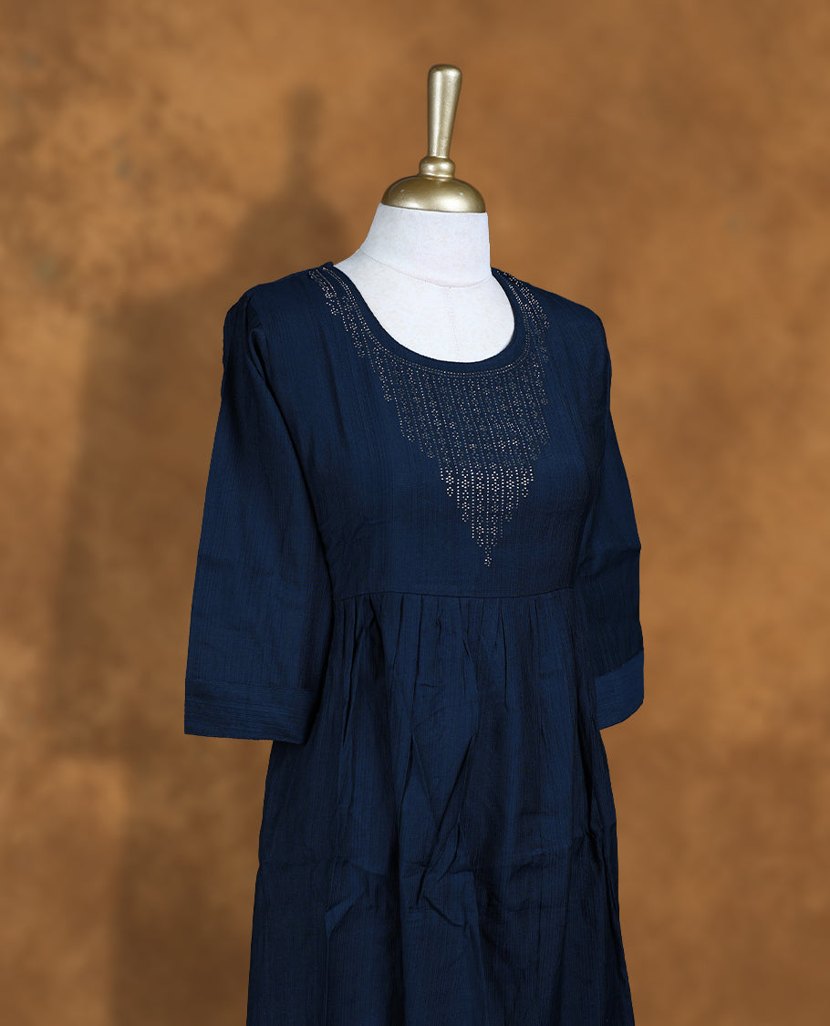 Dark blue colour Kurti featuring a round neckline with white stone detail, and sleeves.