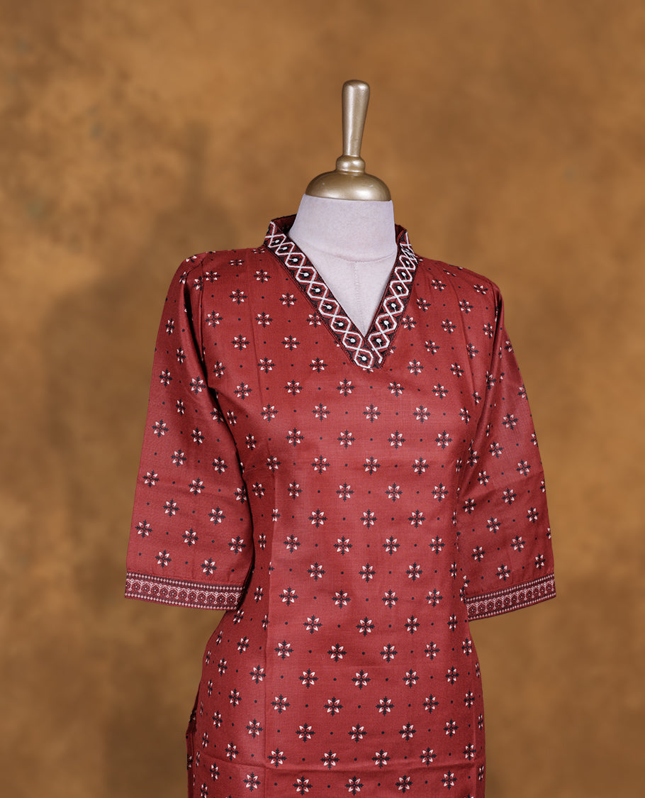 Brown colour kurti with styled with a thread pattern around neckline, print on body knee length design, and a sleeve .