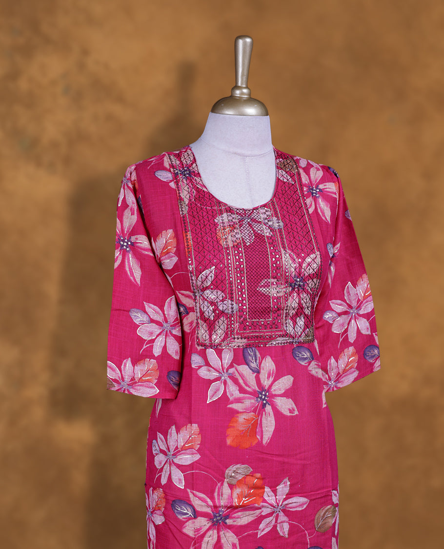 Rani pink colour kurti with styled with a thread pattern around neckline & Floral print across body, knee length design, and a sleeve .