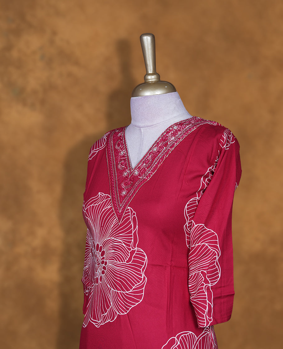 Rani pink colour kurti with White floral prints, knee length design, styled with a thread work on V neckline and a sleeve .