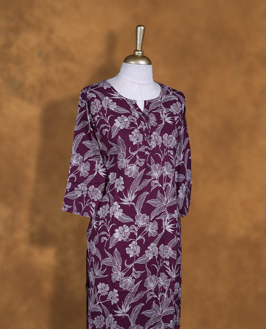 Purple colour Kurti featuring floral print pattern across, round neckline with split, and sleeves,