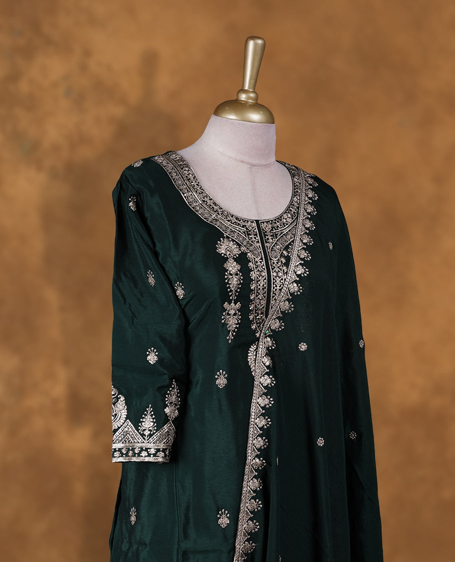 Dark green colour sharara set featuring thread and embroidered and beats pattern neckline, sleeves, and thread embroidery on body , Paired with a matching dupatta
