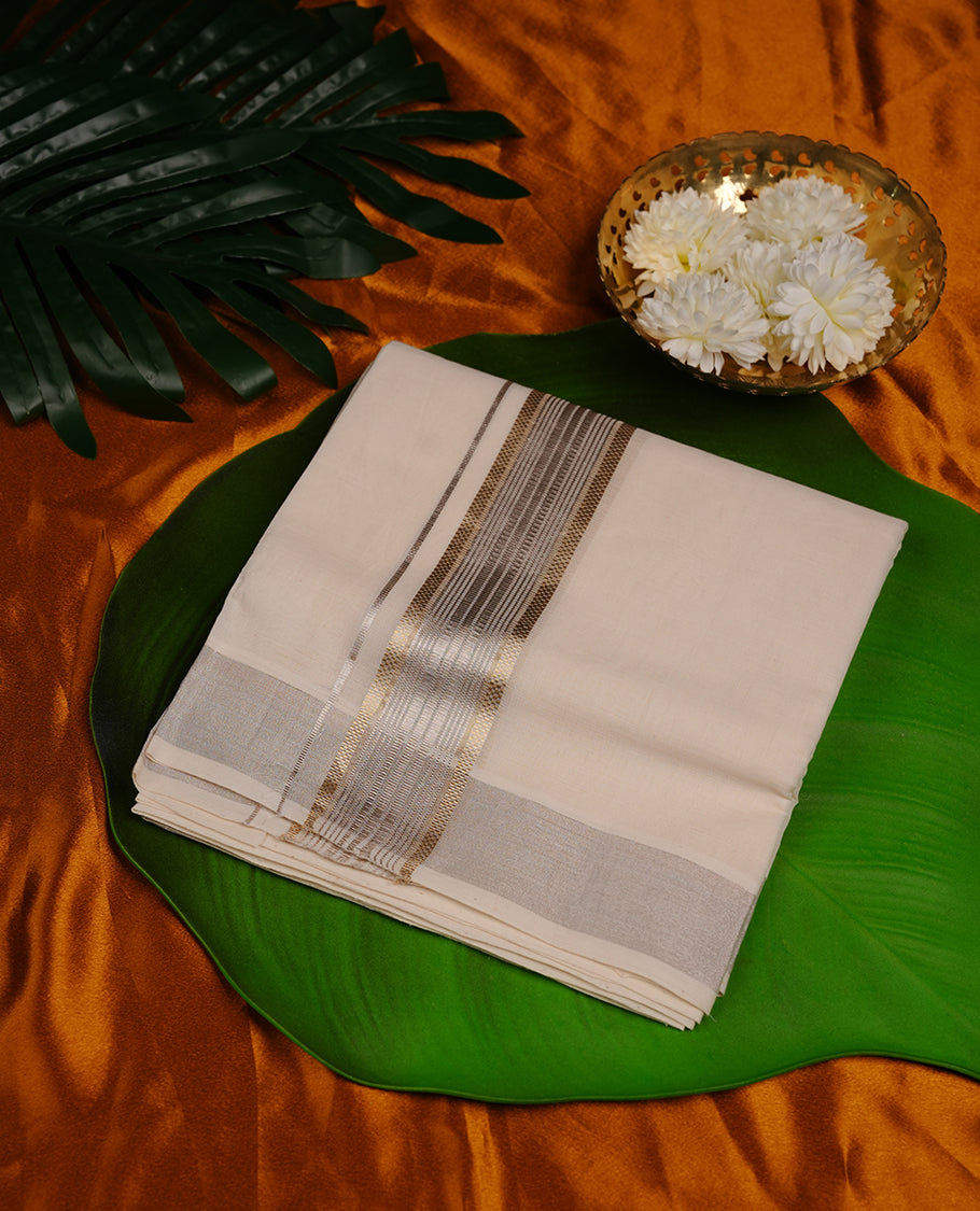 Cream colour cotton double dhoti featuring light gold and silver colour border