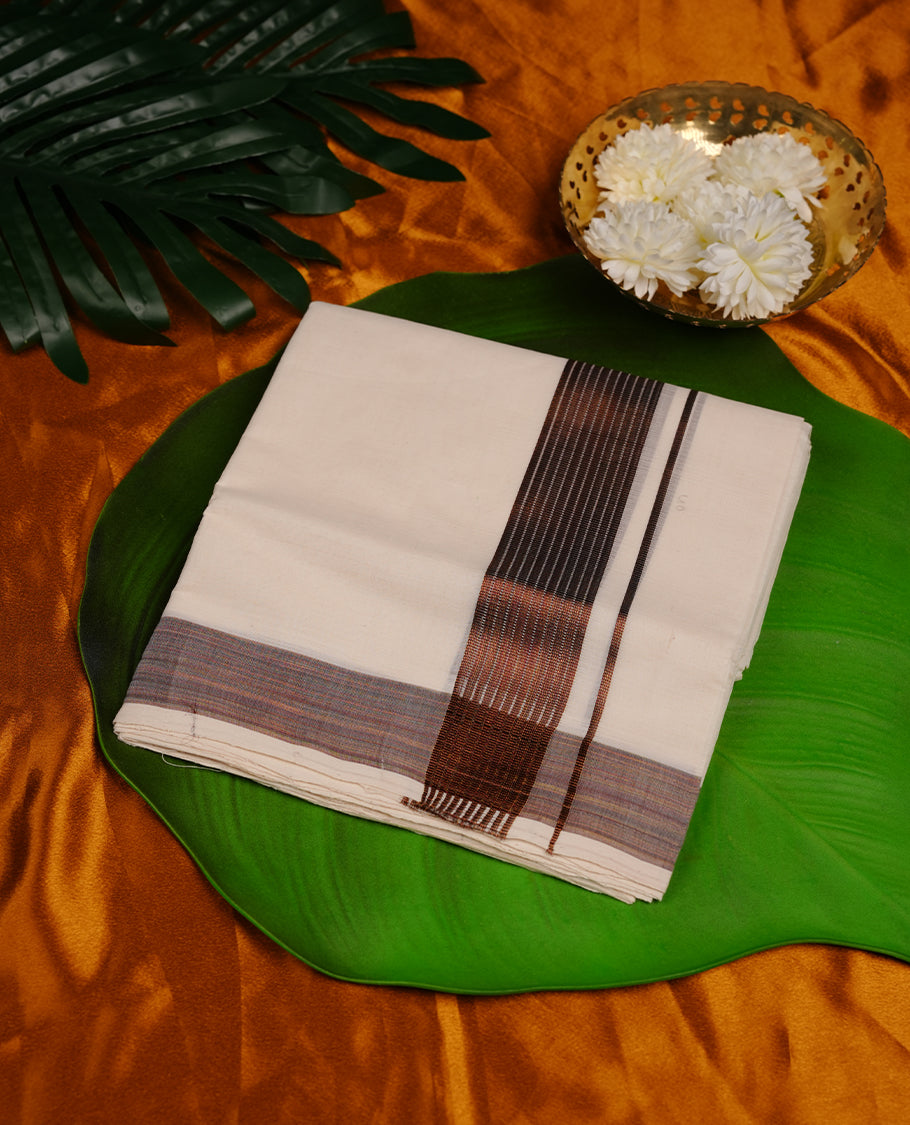 Cream colour cotton double dhoti featuring 3 inch copper colour border