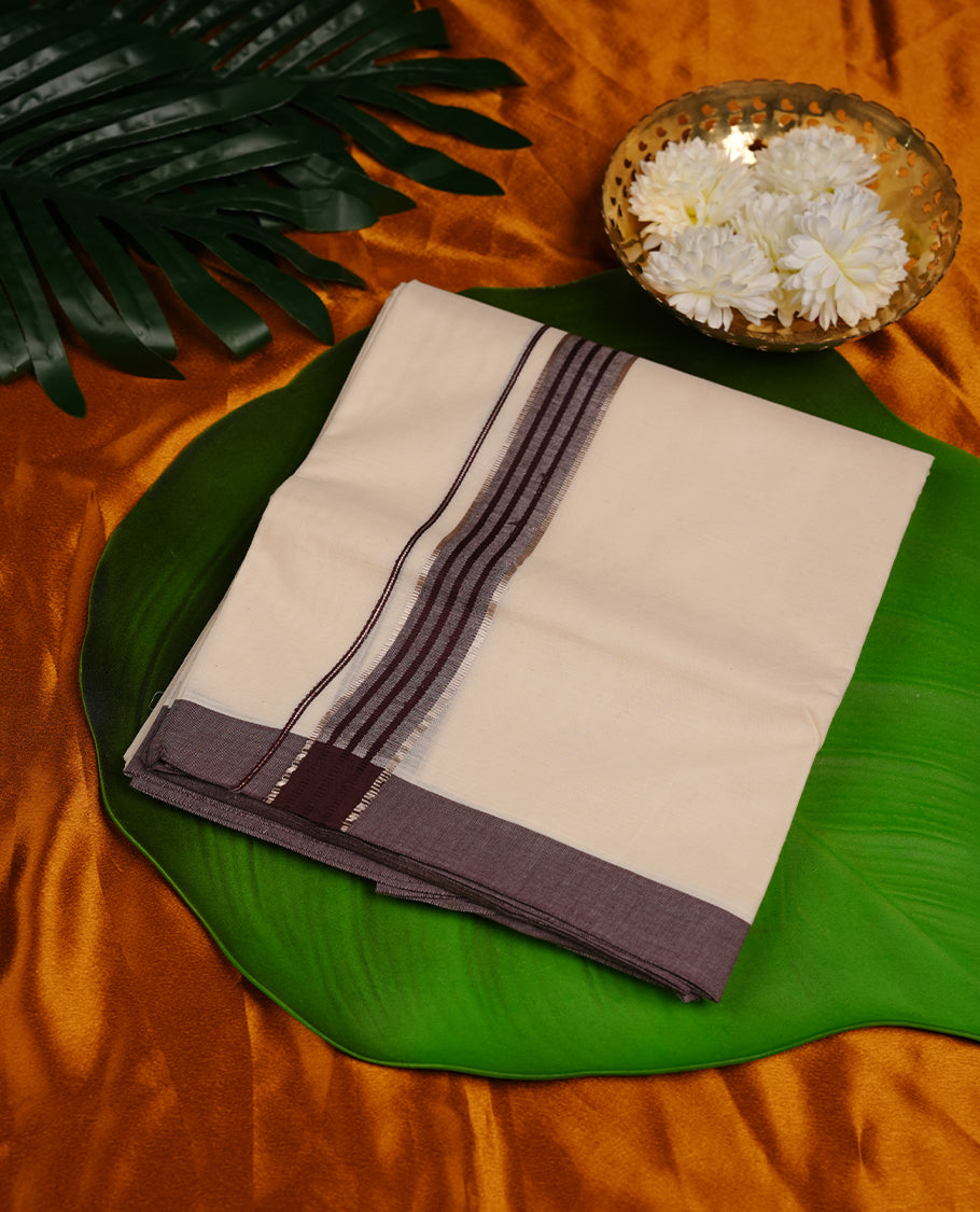 Cream colour cotton double dhoti featuring brown colour border with silver zari border