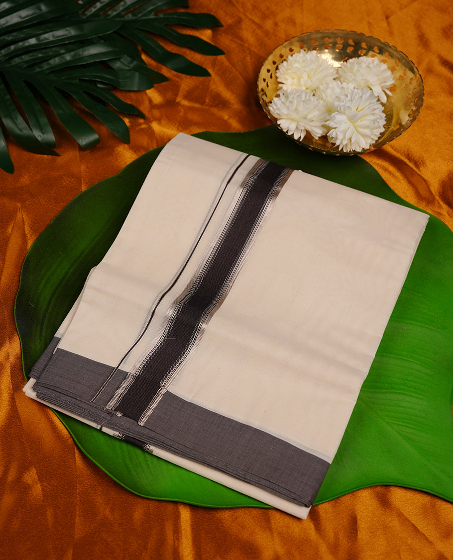 Cream colour cotton double dhoti featuring charcoal black and silver kasavu zari border