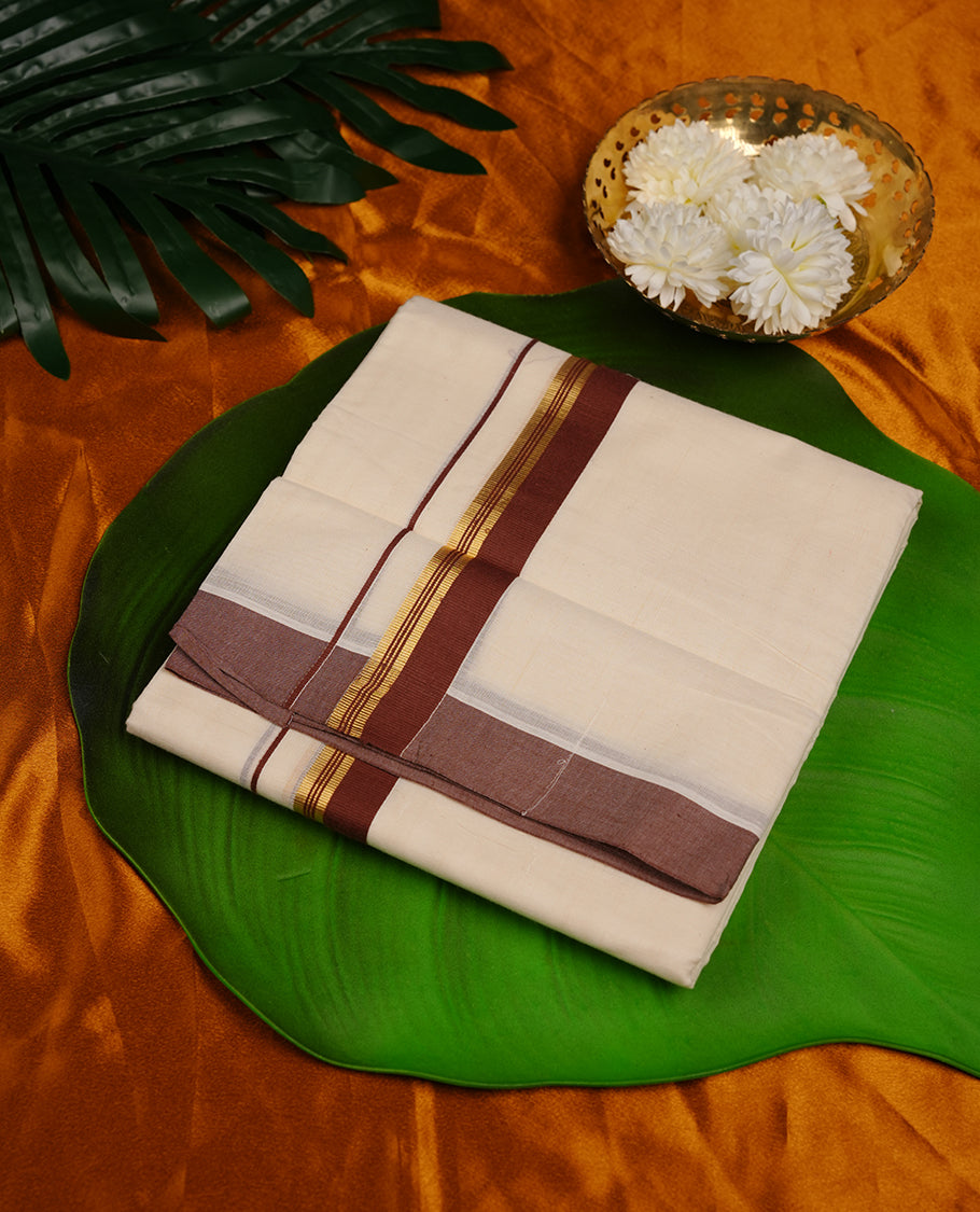 Cream colour cotton double dhoti featuring dark brown and gold border.