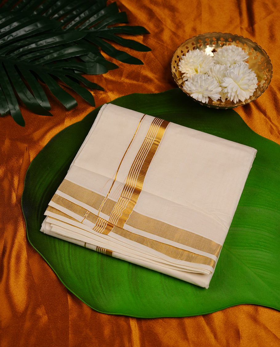 Cream colour cotton double dhoti featuring gold stripes kasavu zari border