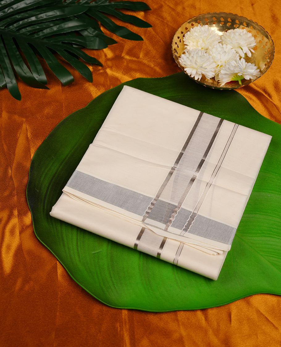Cream colour cotton double dhoti featuring silver kasavu zari border