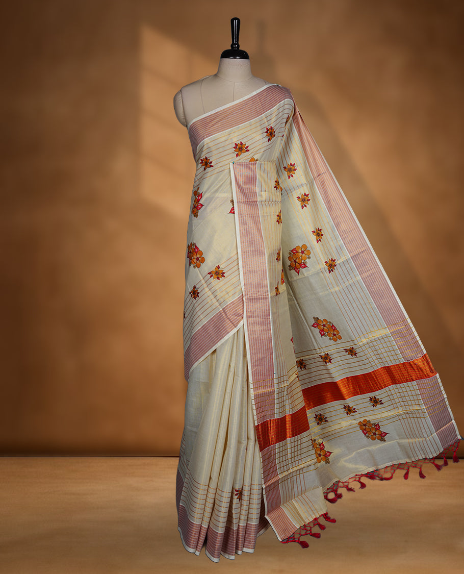Light gold colour Tissue Kerala saree featuring a Plain body, an intricately woven gold and orange traditional border with floral print and stripes on pallu, paired with a matching blouse.