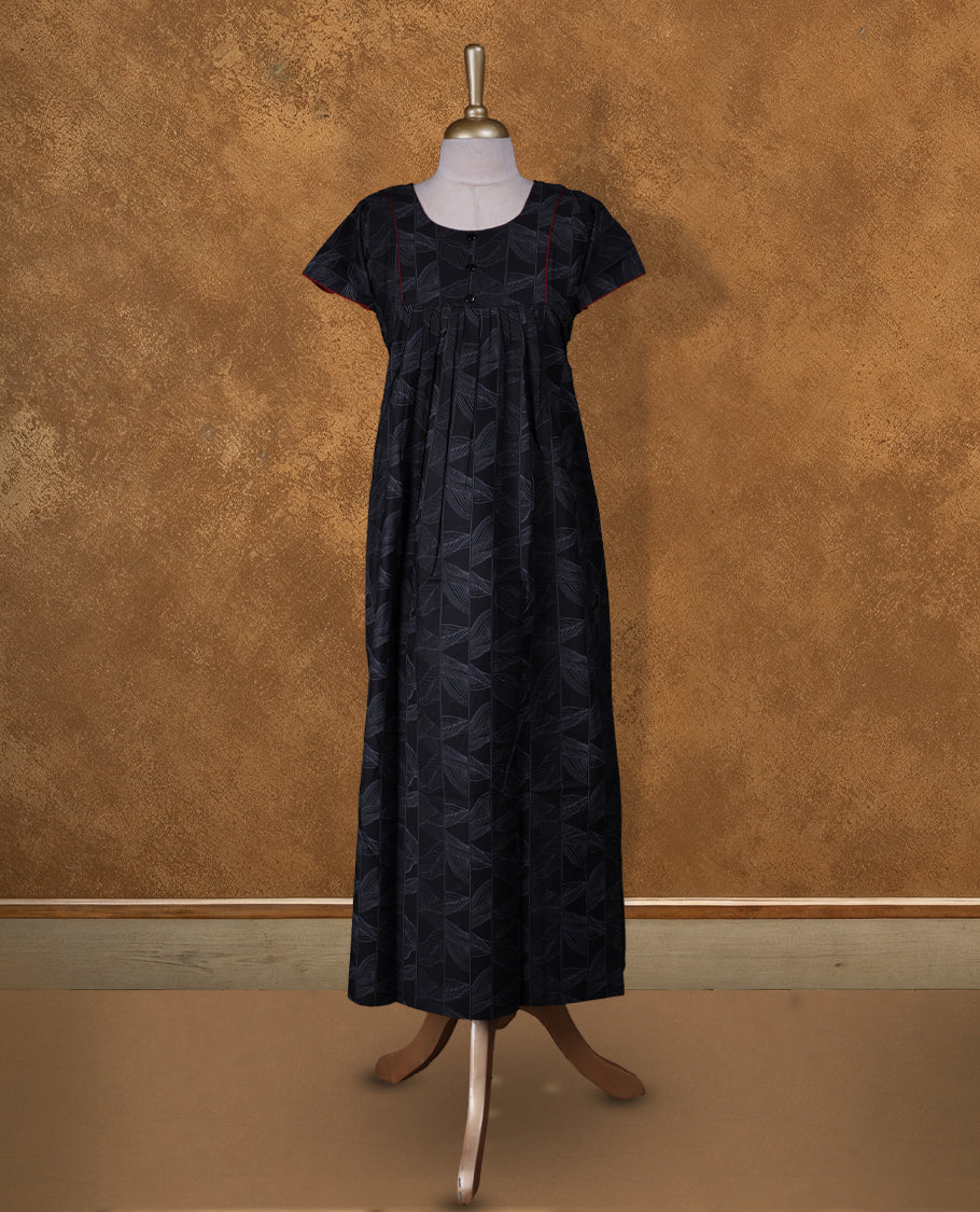 Black colour NStyle nighty featuring gray floral patterns, a U-neckline with lace detailing, short sleeves, and a full ankle-length design.