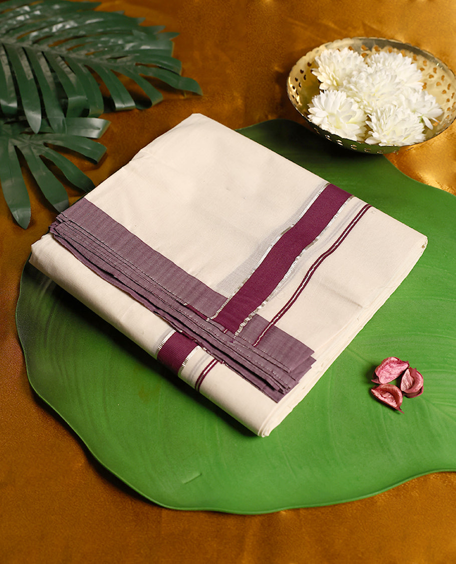 Off white pure cotton double dhoti featuring a rich grape border highlighted with silver zari stripe detailing, offering a traditional and sophisticated look perfect for cultural and festive wear.