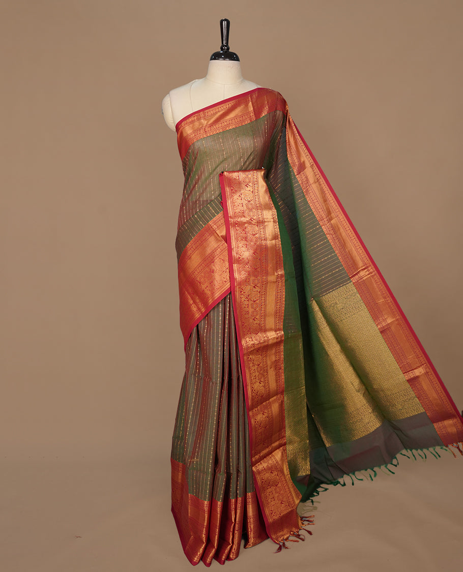 Green & red double shade colour chettinad saree featuring gold zari stripes on body, complemented by contrast Red colour with traditional border, paired with matching blouse piece.