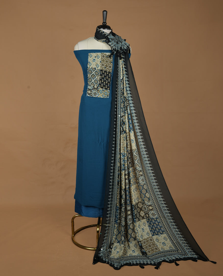 Blue colour georgette salwar suit collection featuring plain body enhanced with elegant black bunch kalamkari print on neck yoke, detailed with subtle mirror work , paired with kalamkari printed dupatta with mirror work with santon material bottom.