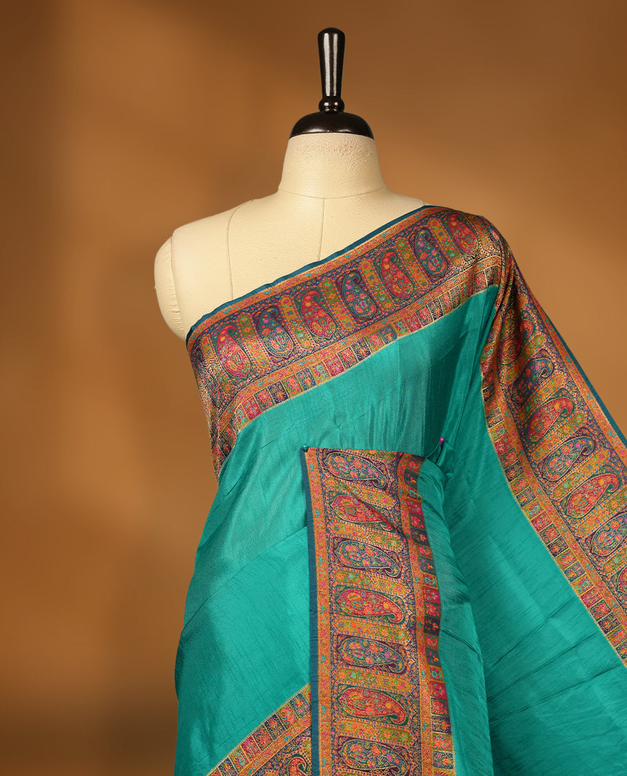 Aqua green colour Pashmina silk saree plain body, framed by an opulent arabesque border and grand storytelling pallu, paired with a matching woven border blouse piece