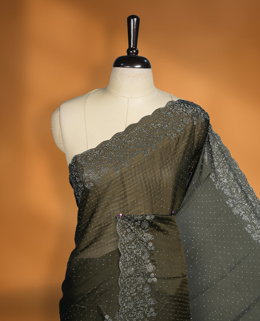 Dark Olive Green Colour Chiffon Designer Saree featuring Delicate White Stone Work All Over the Body, with Stone Detailing on the Border and Pallu, paired with a Matching Blouse.