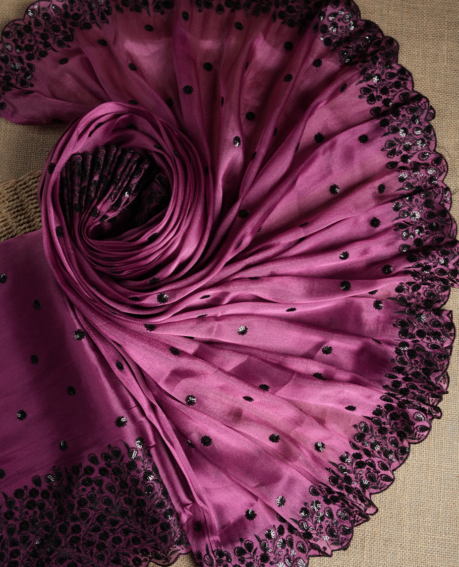 Elegant Mulberry pink colour suit material adorned with black sequin embroidery and floral lace border. Comes with a matching dupatta featuring elegant embroidered motifs and a plain bottom