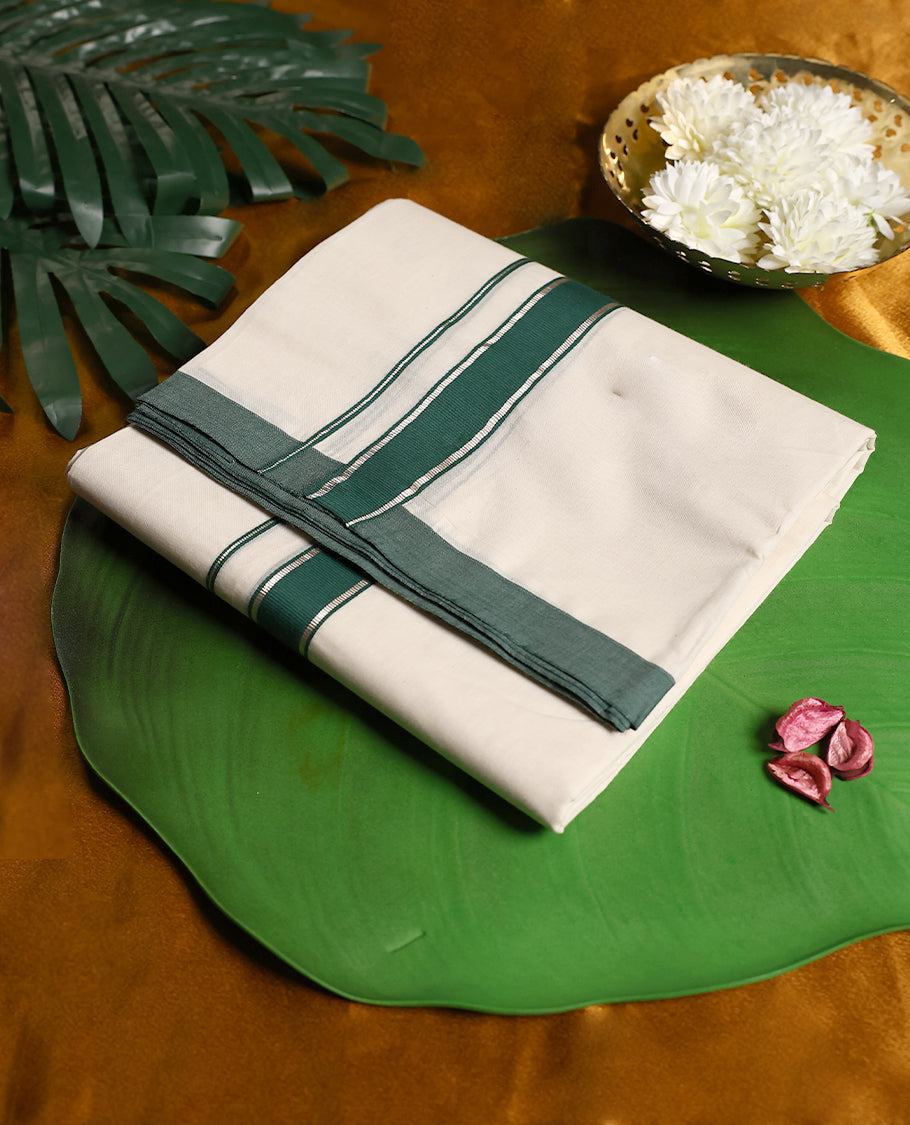 Off white colour cotton double dhoti featuring a classic deep green border with fine stripe accents, offering a simple yet graceful traditional look perfect for rituals, weddings, and festive occasions.