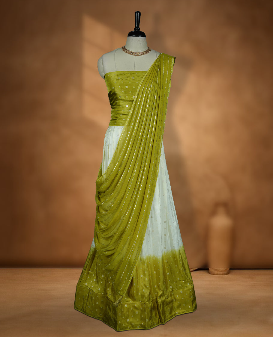 Off white semi banaras semi stitched dhavani set featuring gold zari motifs and contrast Olive colour border, unstitched gold zari blouse piece and matching Duptta with gold zari stripes.