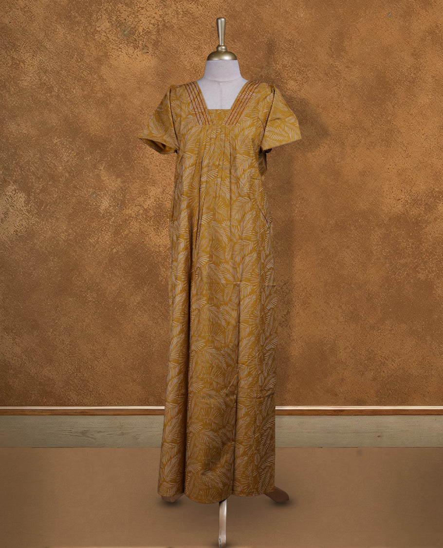 Mustrad colour Nstyle nighty with featuring a cream colour leaf pattern, a V neckline with thrread detailing, short sleeve, and a full-length