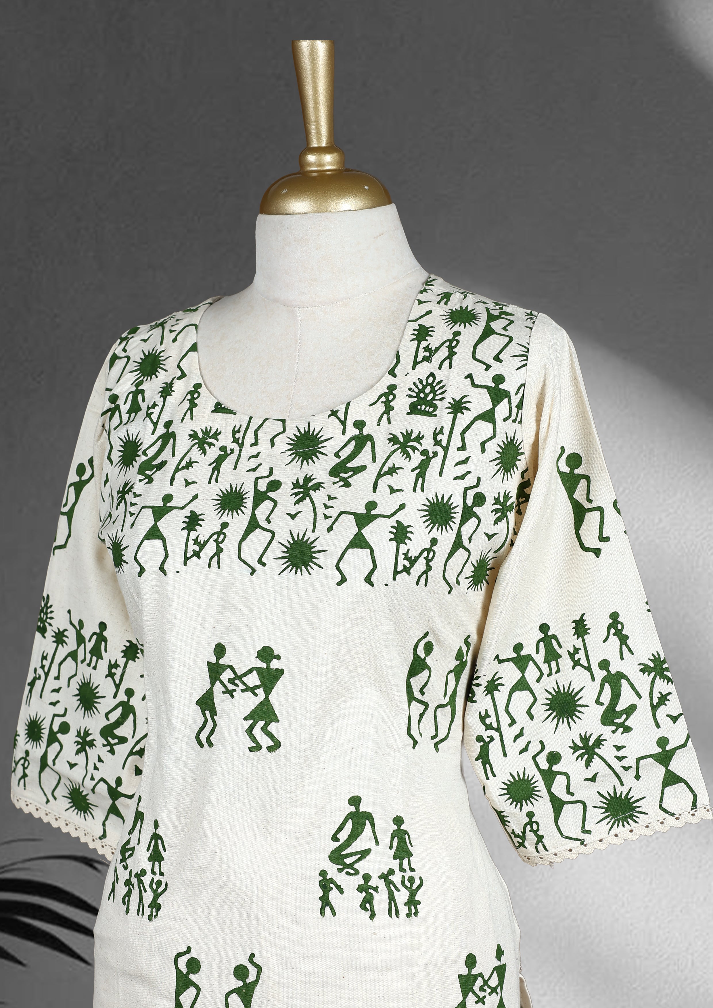 Off white colour cord set with green Warli inspired prints, featuring a round neckline straight kurta with 3/4th sleeves and front slit, paired with matching printed straight pants.