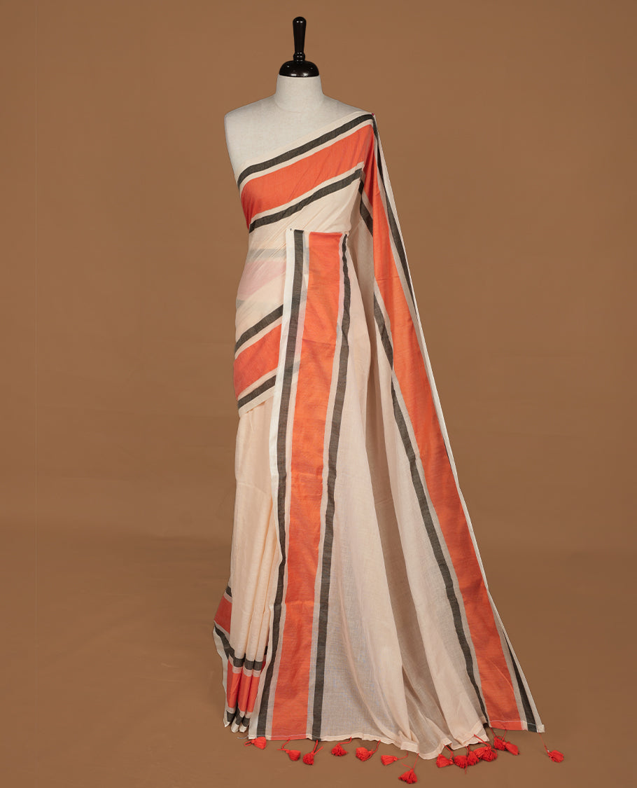 Sandal colour saree with Orange tones, featuring a minimal plain design on the body, without blouse piece.