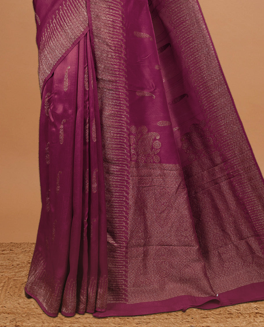 Dark Rouge colour Semi Banaras Tussar Georgette Featuring Gold zari Leaf pattern on body, Finished with Gold zari border and paired with matching blouse piece.
