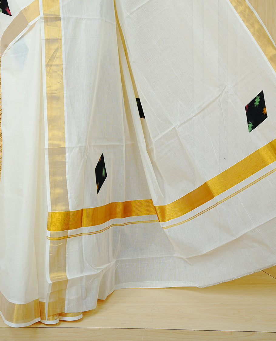 Cream Colour Kerala Saree Featuring Black Colour Geometric Motifs And A Classic Gold Zari Border, Paired With A Matching Blouse Piece.